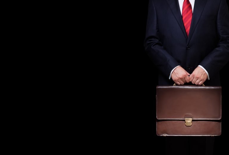 Man In Suite With Briefcase - US Trademark Attorney